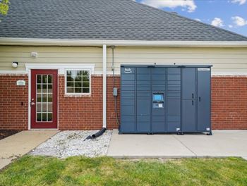a garage door in front of a brick house
